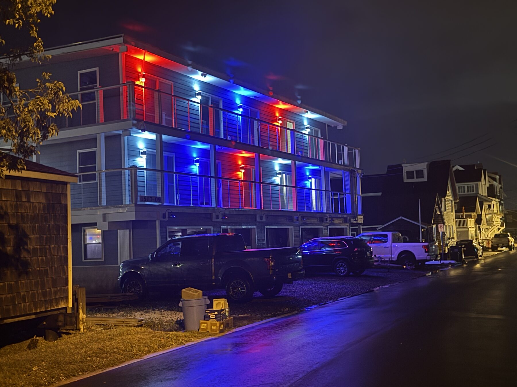 Yacht Avenue Condos at night lit in red, white, and blue for the Fourth of July